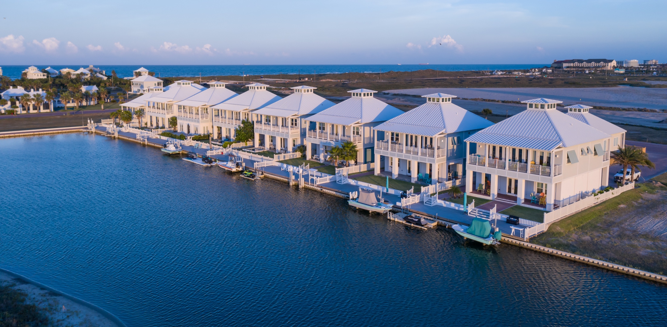 The Shores Villas waterfront row with private docks at dusk