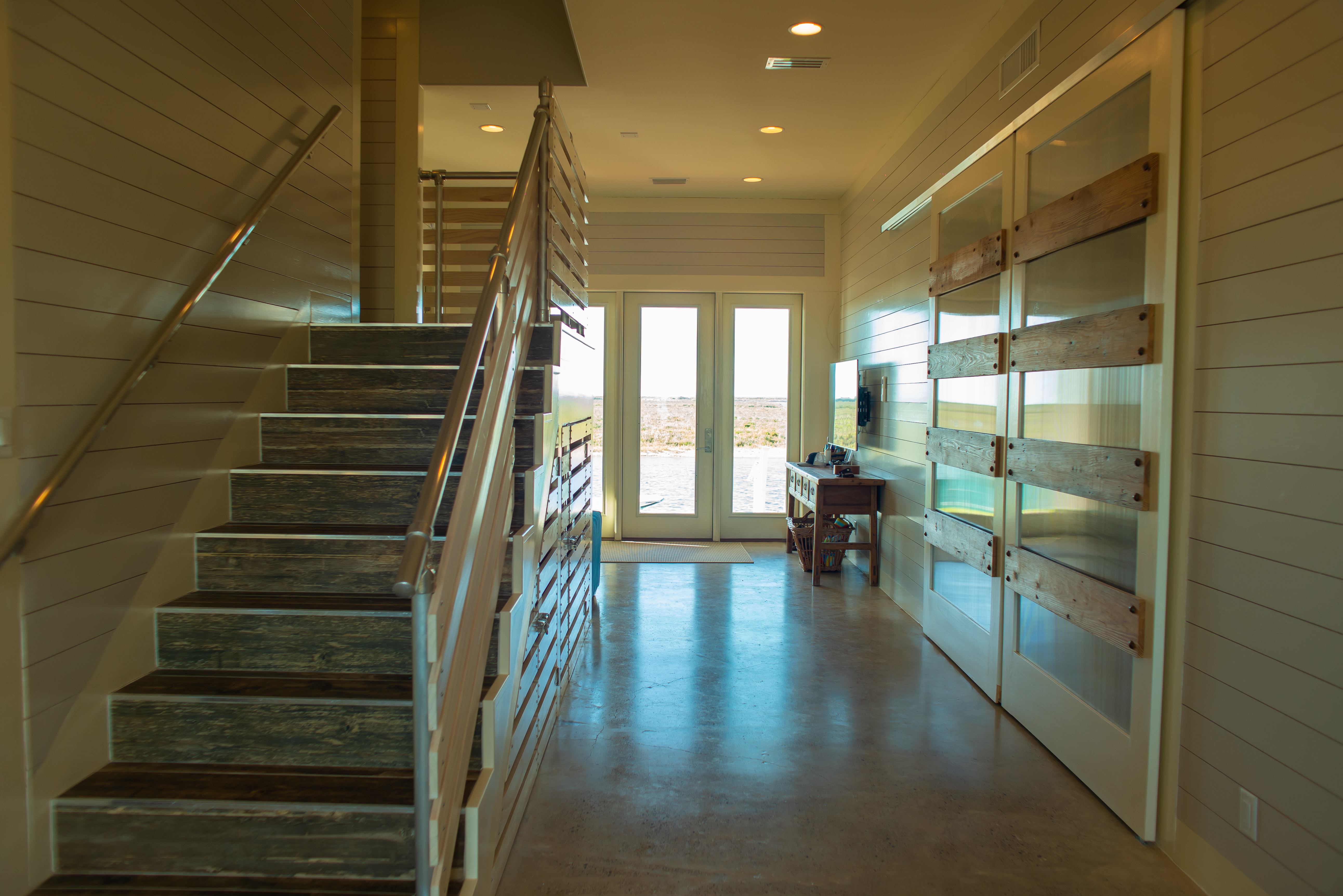 Entryway with staircase and barn door details